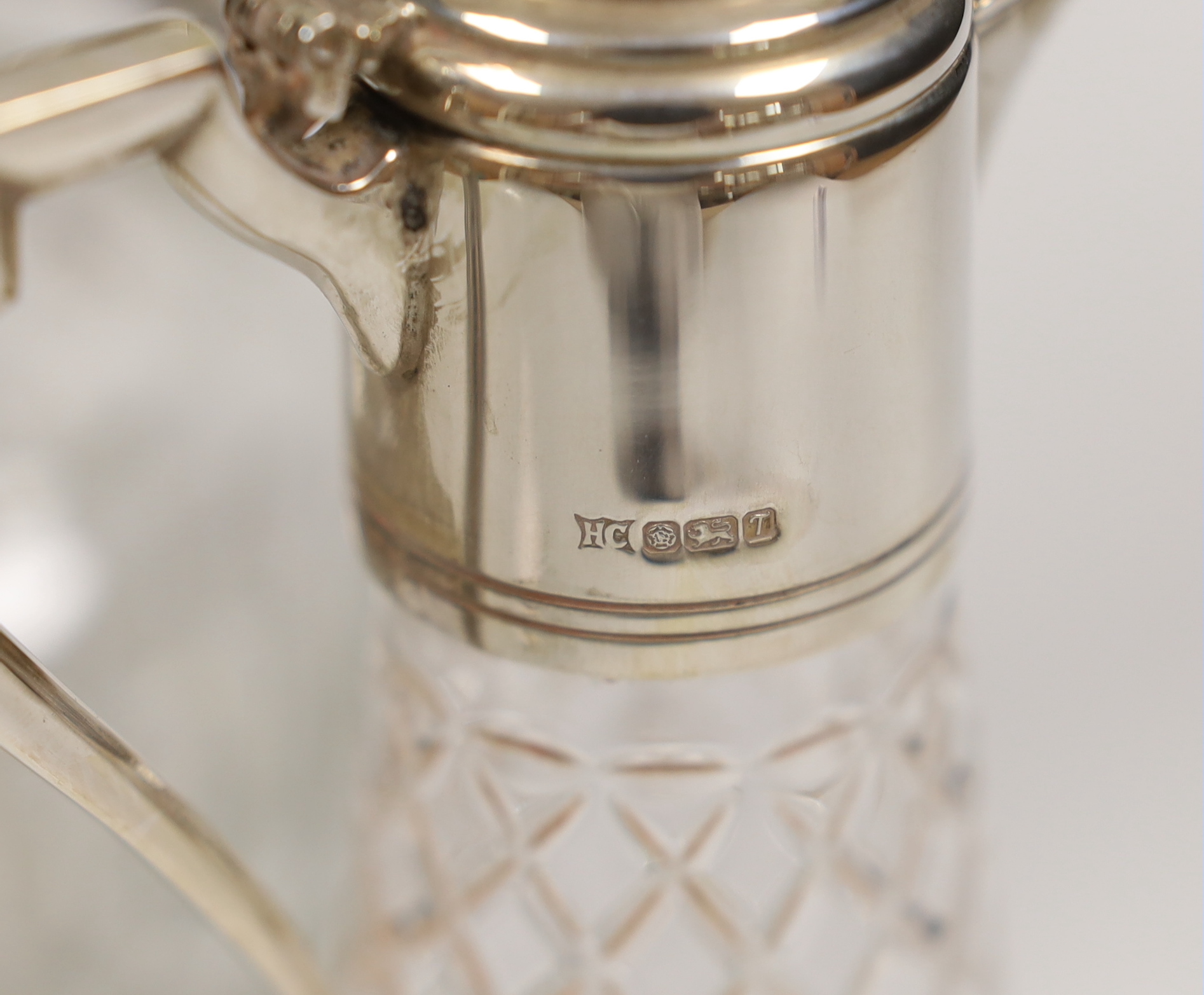 A modern silver mounted liqueur jug, Sheffield, 1993, 20.5cm and a plated mounted claret jug.